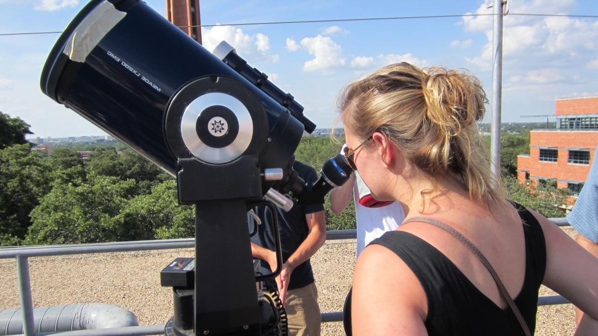 Students looking through a telescope